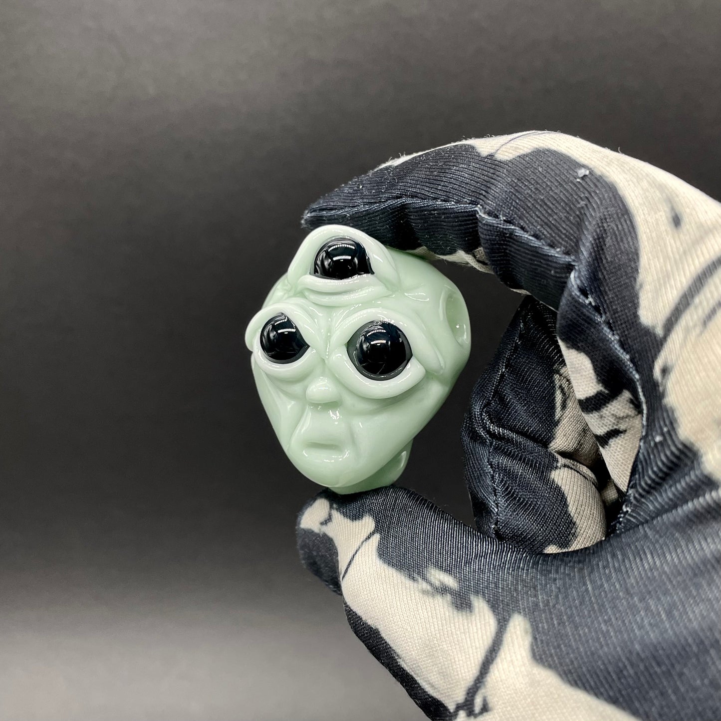 Time manipulating three eye glass alien pendant