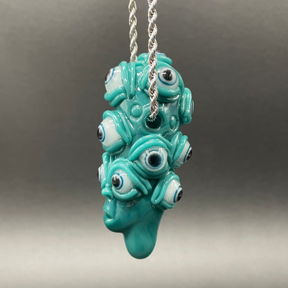 The Never-Blinking One glass effigy pendant