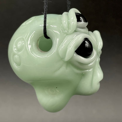 Time manipulating three eye glass alien pendant
