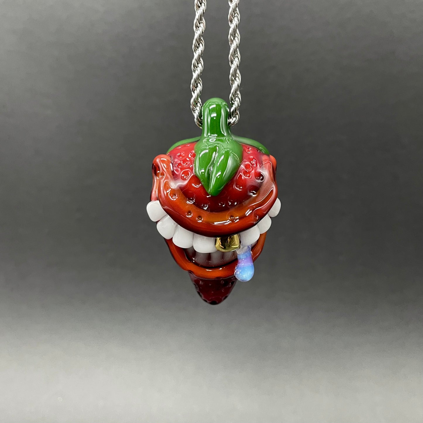 Toothy strawberry pendant