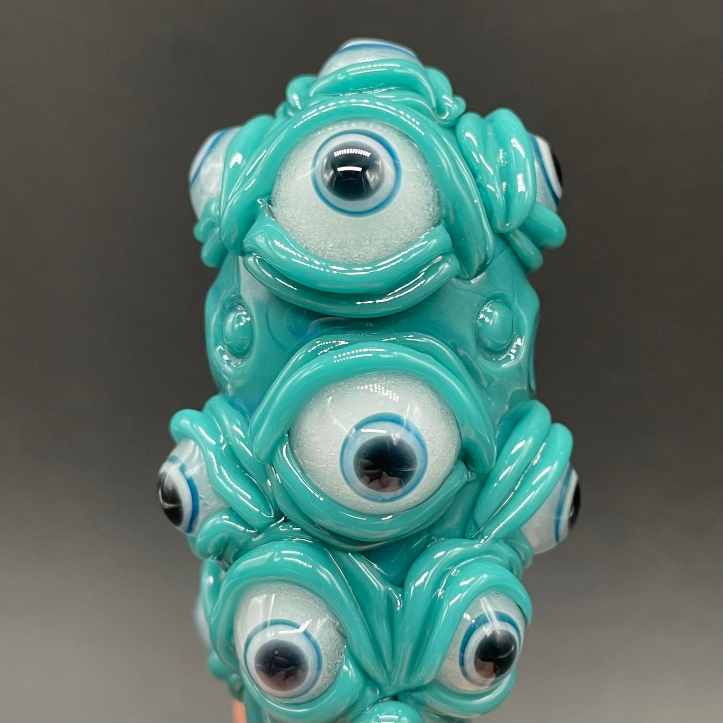 The Never-Blinking One glass effigy pendant