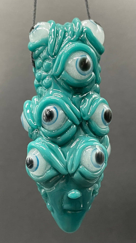 The Never-Blinking One glass effigy pendant