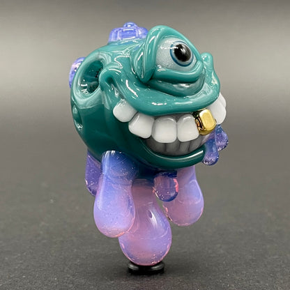 Dripping with sarcasm - Agua azule Drippy, grinning pendant