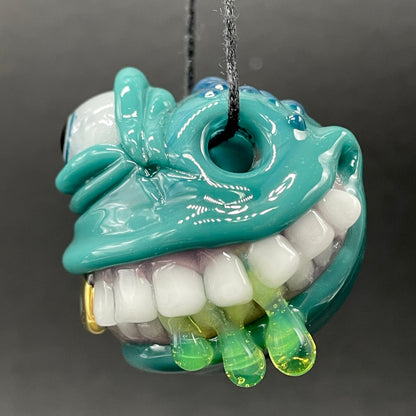 Grinning like a fool glass pendant