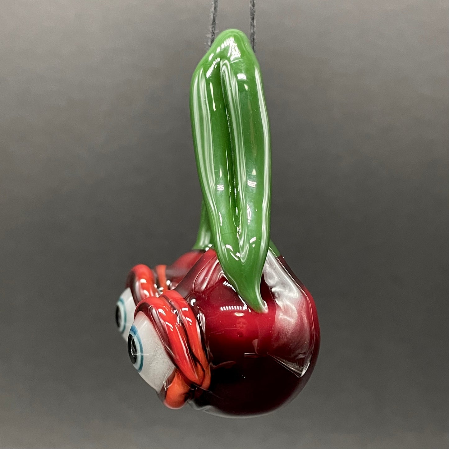 Cherry flavored glass eye pendant
