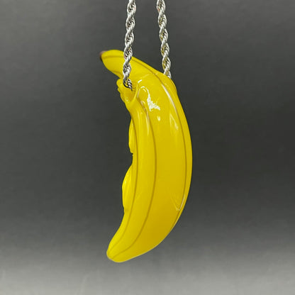 Grinning glass banana pendant