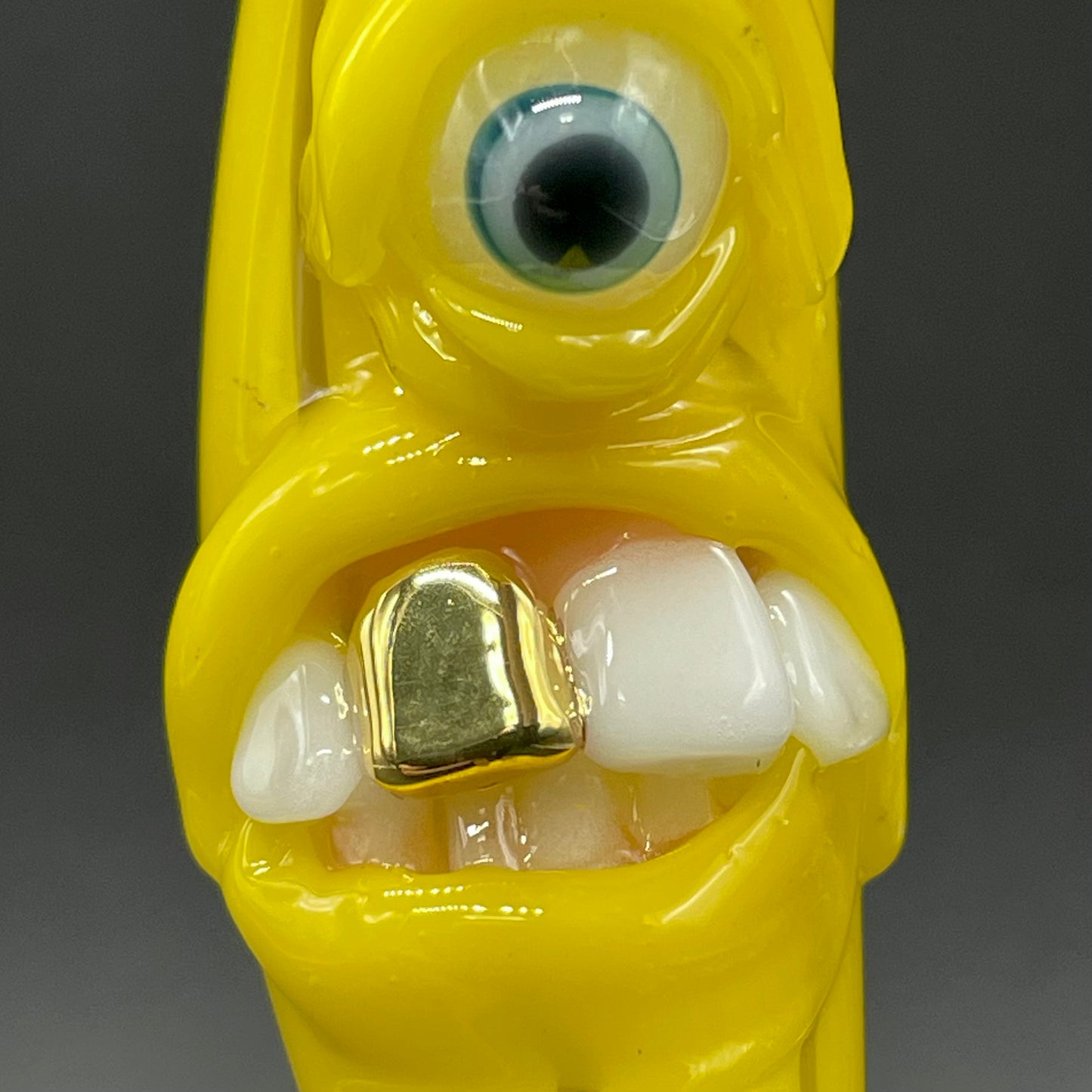 Grinning glass banana pendant